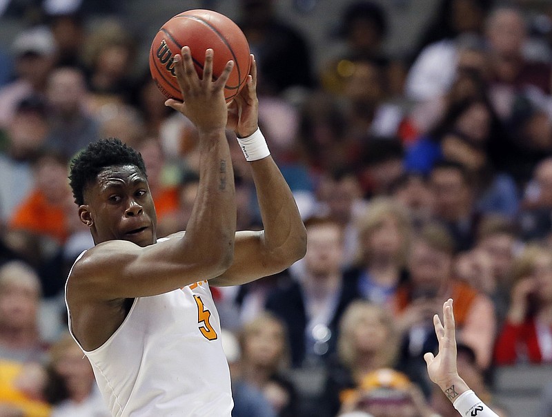 Tennessee forward Admiral Schofield (5) looks to make a pass as Wright State forward Everett Winchester (2) defends in the second half of a first-round game of the NCAA college basketball tournament in Dallas, Thursday, March 15, 2018. (AP Photo/Tony Gutierrez)