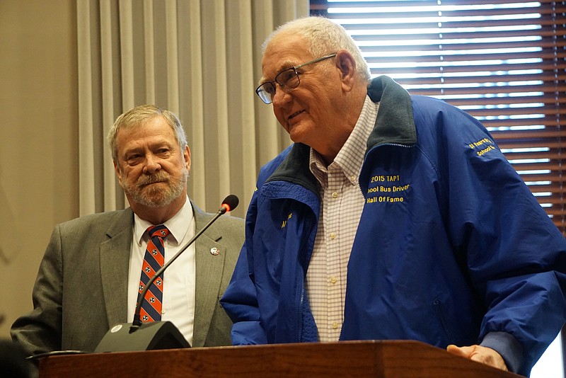 The Hamilton County Commission honored local bus driver Alvin Lee, right, Wednesday morning for his 52 years of service to county schools. Commissioner Chester Bankston is at left.