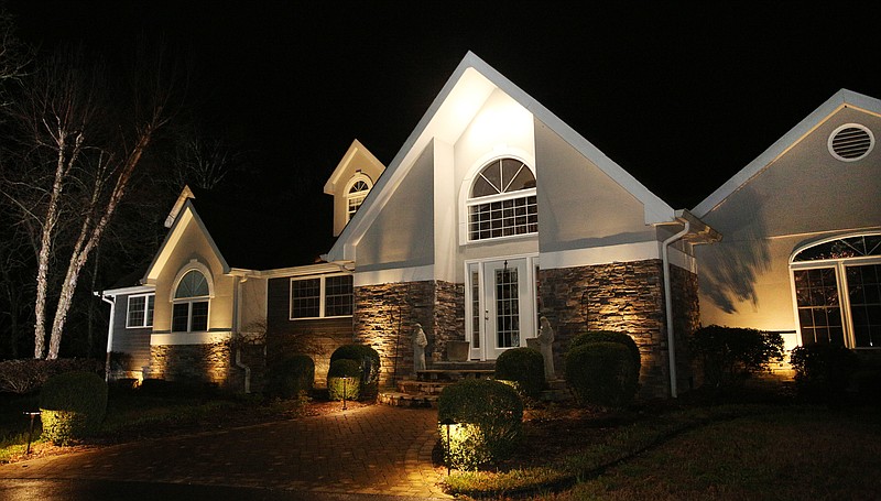 Several fixtures light the outside of Rip and Lorie Connell's home in Chickamauga, Ga. The outdoor lighting helps make the Connells feel safer in their house, and they say it gives their house a wow factor when they make their way up their driveway at night.