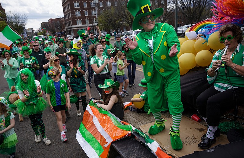 The Irish Descendants of Chattanooga group marches in the St. Chatty's Day Parade in celebration of St. Patrick's Day on Saturday, March 17, 2018, in Chattanooga, Tenn. Instead of its usual route across the Market Street Bridge, this year's parade traveled along Main Street to Market Street past the Chattanooga Choo Choo.