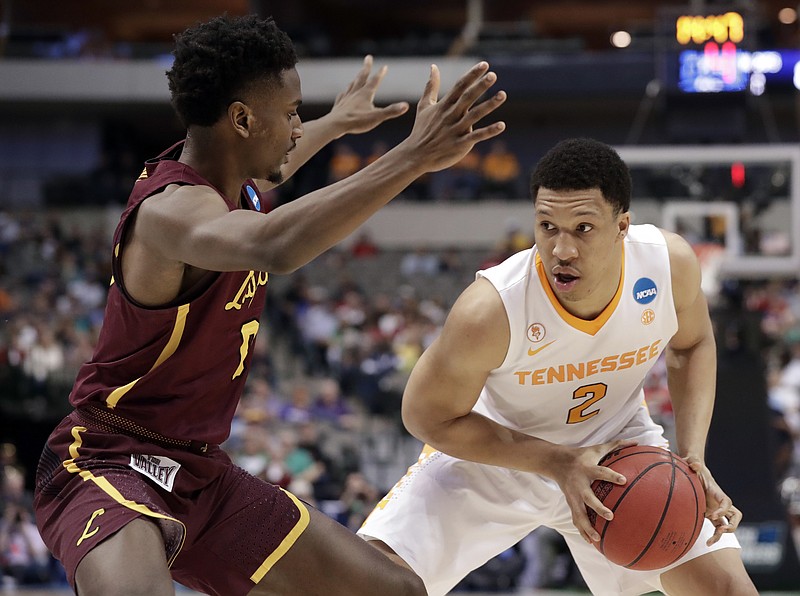Loyola-Chicago guard Donte Ingram (0) defends against Tennessee forward Grant Williams (2) during the first half of a second-round game at the NCAA men's college basketball tournament in Dallas, Saturday, March 17, 2018. (AP Photo/Tony Gutierrez)