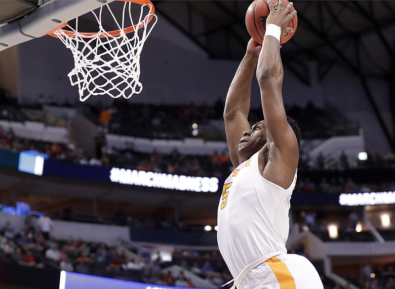 Tennessee forward Admiral Schofield goes up for an uncontested dunk during the first half of the team's second-round game against Loyola-Chicago at the NCAA men's college basketball tournament in Dallas, Saturday, March 17, 2018. (AP Photo/Tony Gutierrez)