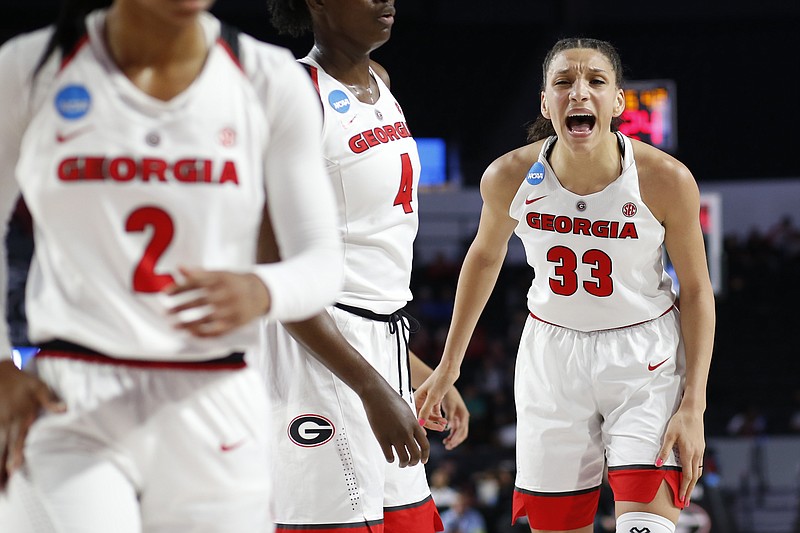 Georgia forward Mackenzie Engram (33) fires up her teammates during the first half of Saturday's NCAA tournament opener against Mercer in Athens, Ga. The host Lady Bulldogs won 68-63, but the SoCon champs were competitive in their first tourney berth.