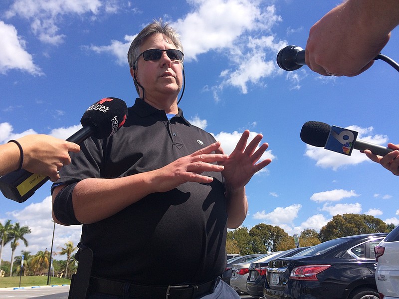 Joe Smitha of Palm Harbor, Fla., speaks with reporters on Saturday, March 17, 2018, about his niece, Alexa Duran, whose family has identified her as one of at least six victims of a bridge collapse near the Florida International University campus in the Miami area on March 15. (AP Photo/Jennifer Kay)