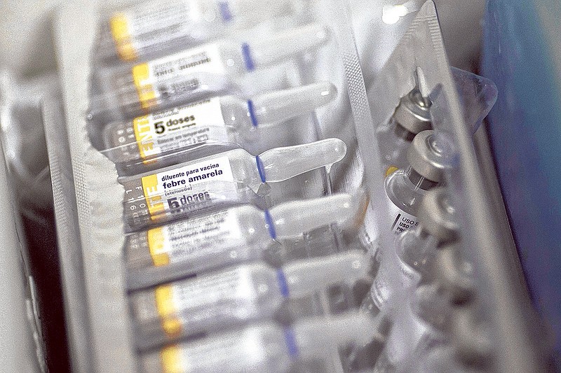 Ampules of yellow fever vaccine are seen in a field hospital in Casimiro de Abreu, Brazil. On Friday, health officials said 10 travelers — none of them American — recently caught yellow fever while visiting Brazil. Four died, and it's a reminder that anyone traveling there should get vaccinated before they go.