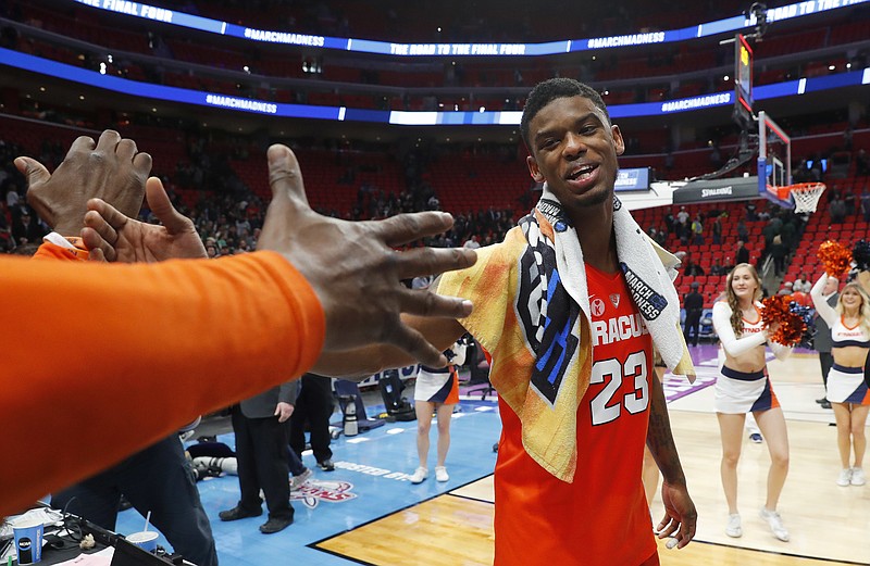 
              Syracuse guard Frank Howard celebrates after defeating Michigan State in an NCAA men's college basketball tournament second-round game in Detroit, Sunday, March 18, 2018. (AP Photo/Paul Sancya)
            