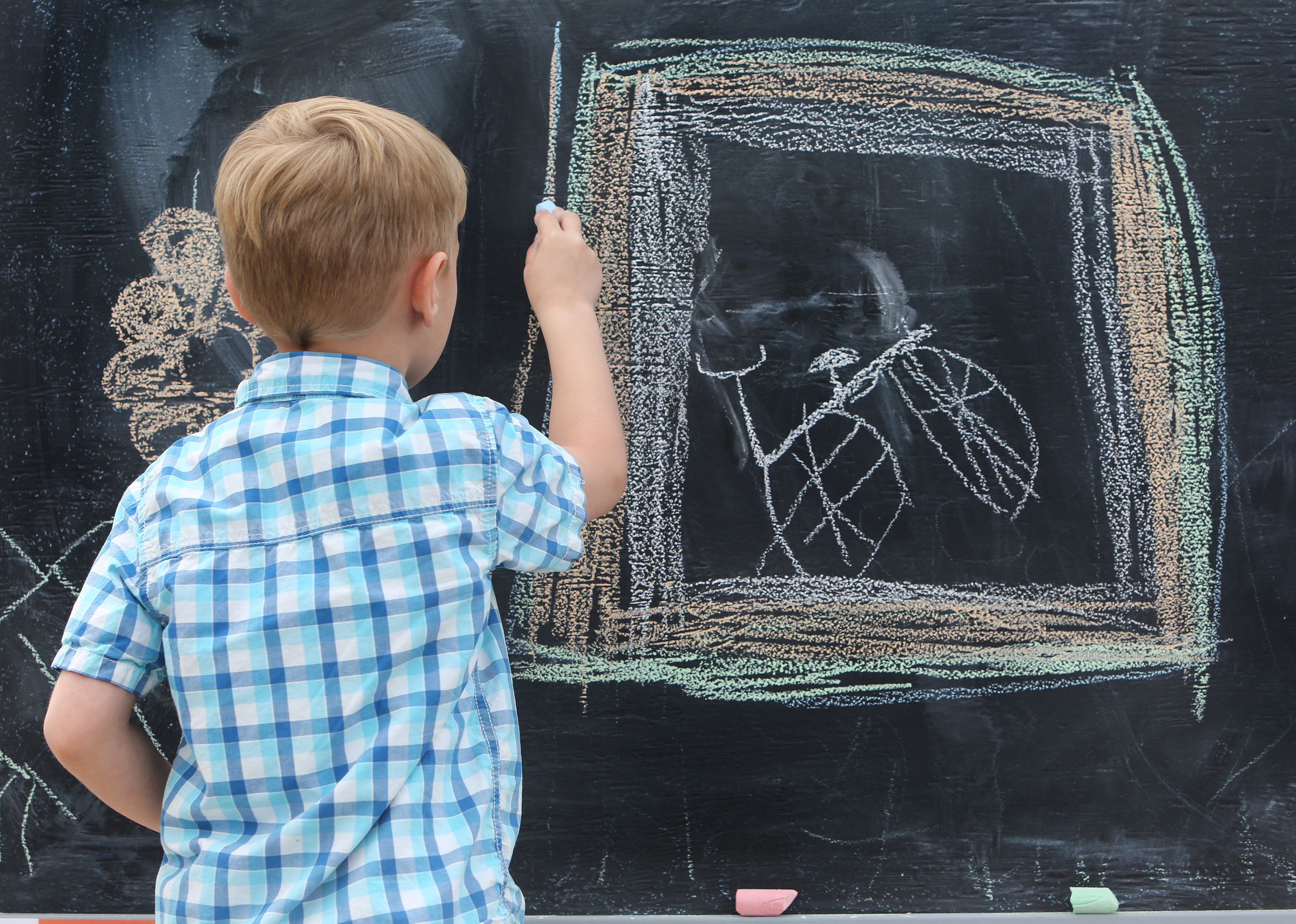 Carson Eischeid, 7, frames in a drawing of a bike he created with chalk at Gilbert-Stephenson Park during a Thriving Communities Initiative interactive art walk pop-up event Sunday, March 18, 2018 in Fort Oglethorpe, Ga. Fort Oglethorpe is one of four cities chosen this year by the Thrive Regional Partnership to receive strategic assistance for the next 10 months from Bridge Innovate design professionals and other community members.