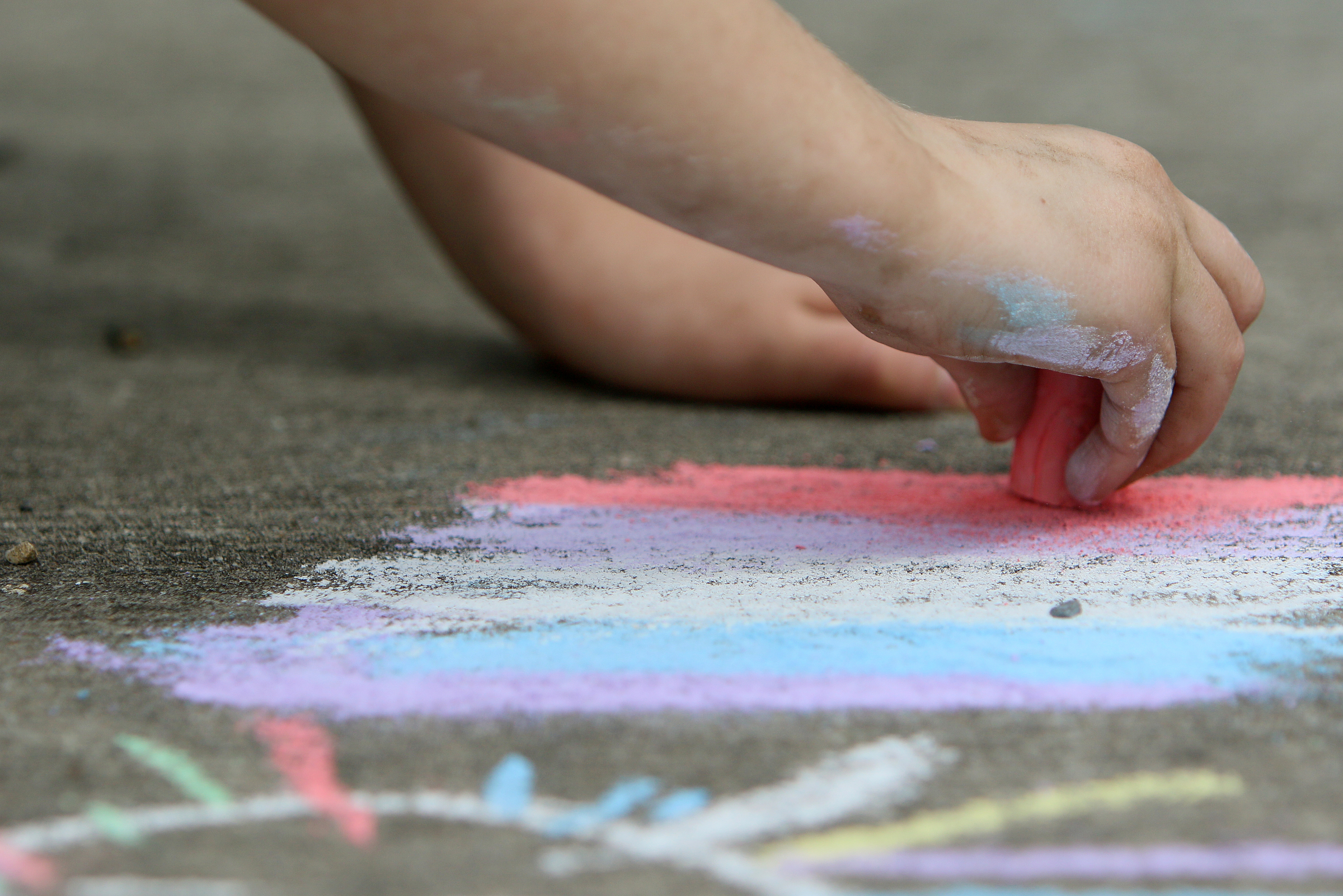 Aubrey Snyder, 4, draws a rainbow at Gilbert-Stephenson Park during a Thriving Communities Initiative interactive art walk pop-up event Sunday, March 18, 2018 in Fort Oglethorpe, Ga. The Thriving Communities Initiative helps Fort Oglethorpe leaders and volunteers enhance life in the city through arts and culture.