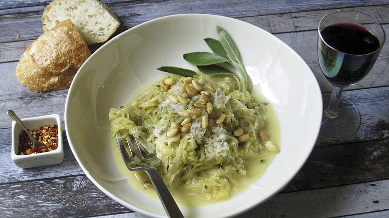 This March 2018 photo shows spaghetti squash with creamy goat cheese sauce and shredded zucchini in New York. This dish is from a recipe by Sara Moulton. (Sara Moulton via AP)