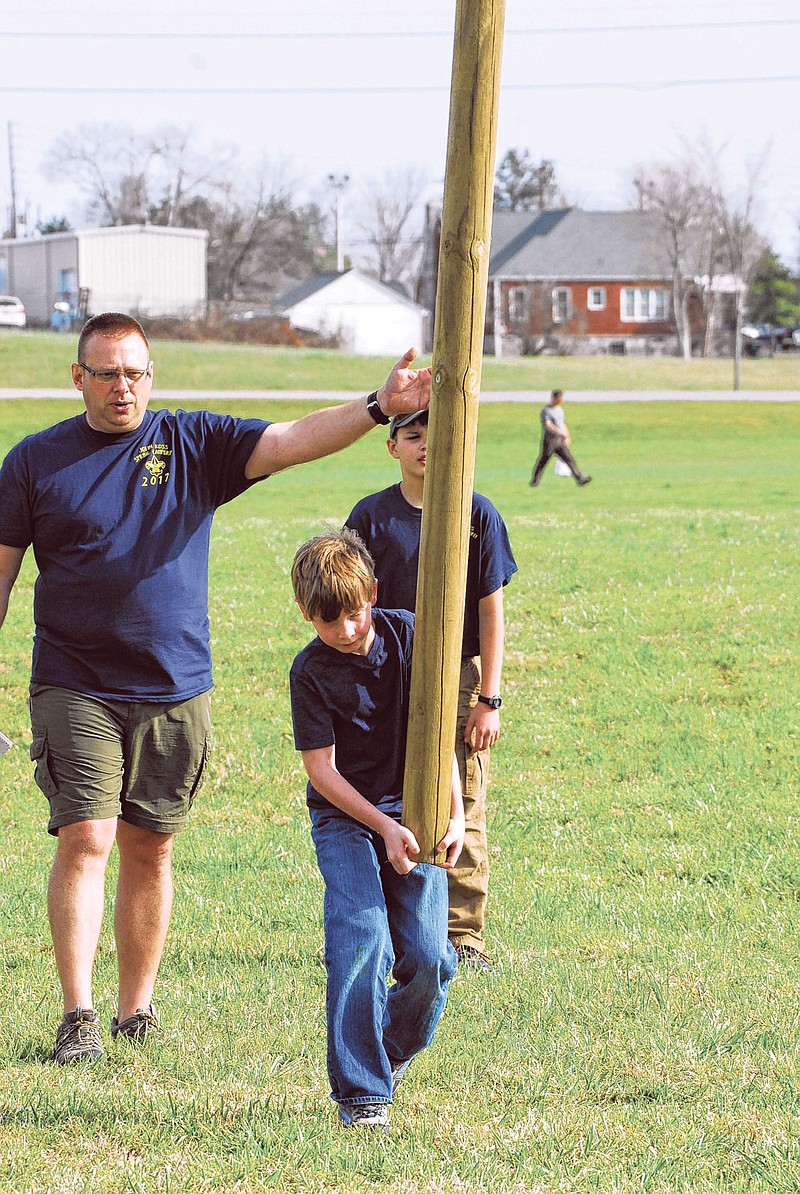 A Boy Scout prepares to compete in the caber toss at last year's Highland Games.