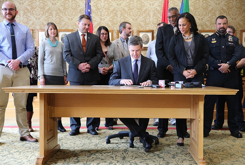 Chattanooga Mayor Andy Berke prepares to sign an executive order Monday, March 19, 2018 at City Hall in Chattanooga, Tenn. The executive order established the City of Chattanooga's Interagency Council on Homelessness. 