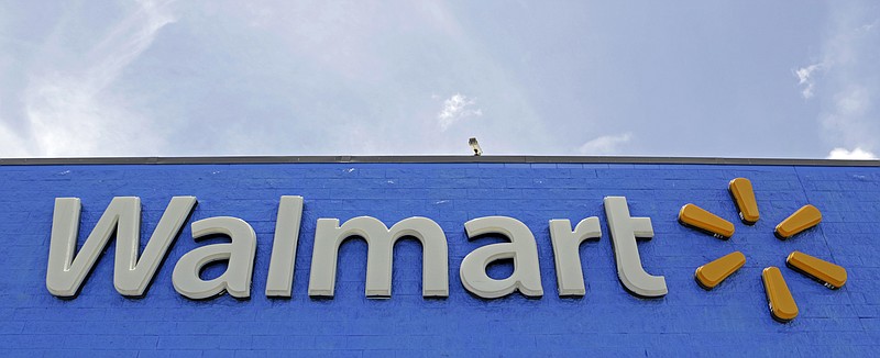 FILE - This June 1, 2017, file photo shows a Walmart store in Hialeah Gardens, Fla. Walmart, the world's largest retailer, is expanding a deal with on-demand online services platform Handy.com, allowing shoppers to hire helpers at 2,000 of its stores nationwide to mount a TV on their wall or assemble a bookcase. (AP Photo/Alan Diaz, File)