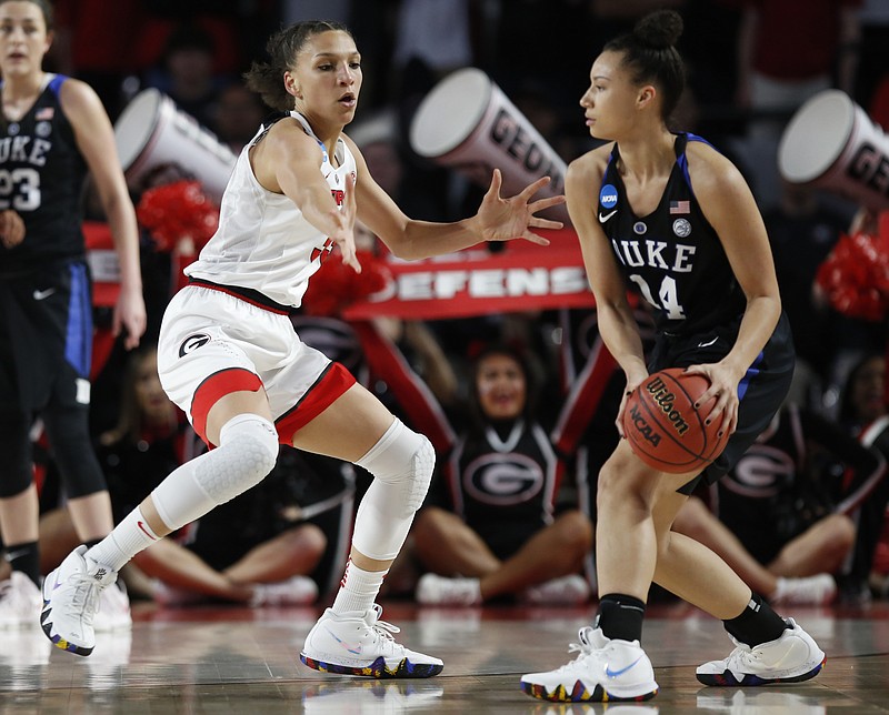 Georgia forward Mackenzie Engram (33) guards Duke guard/forward Faith Suggs (14) during the first half of a second-round game in the NCAA women's college basketball tournament in Athens, Ga., Monday, March 19, 2018. (AP Photo/Joshua L. Jones)