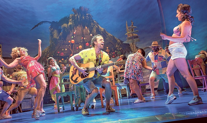 Paul Alexander Nolan, center, is Tully, a resort-island singer with a passing resemblance to Jimmy Buffett, in the jukebox musical "Escape to Margaritaville." (Contributed photo by Sara Krulwich/The New York Times)