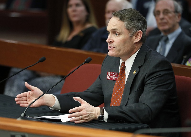 In this Feb. 13, 2018 file photo, Rep. Ed Setzler presents his bill to the Governmental Affairs Special Subcommittee on Voting Technology in Atlanta. Georgia lawmakers are considering a proposal that would move the state from its 16-year-old electronic voting system to one that uses paper ballots. Setzler of Acworth says the measure will ensure election results can be audited and bolster voter confidence. The measure has already passed the Senate. (Bob Andres/Atlanta Journal-Constitution via AP)