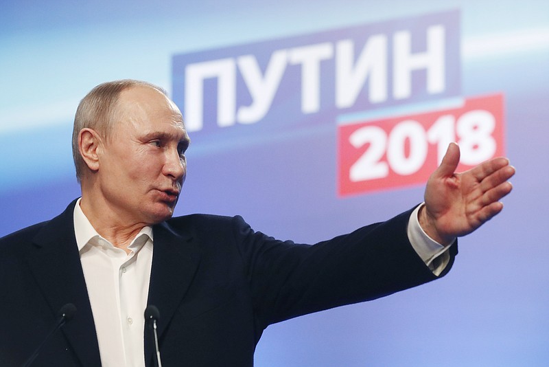 Russian President Vladimir Putin gestures during a news conference after meeting with his staff at the campaign headquarters in Moscow, Russia, Sunday, March 18, 2018. Russian President Vladimir Putin has dodged a question about his plans after serving another six-year term he has won. Putin wouldn't be eligible under the constitution to compete in the 2024 election since there is a limit of two consecutive terms. (Sergei Chirikov/Pool photo via AP)