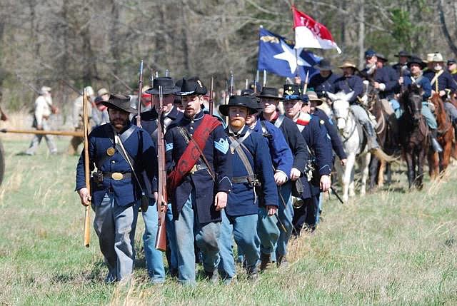 Union soldiers march through the fields of the McGraw farm in a previous re-enactment. (Contributed Photos)