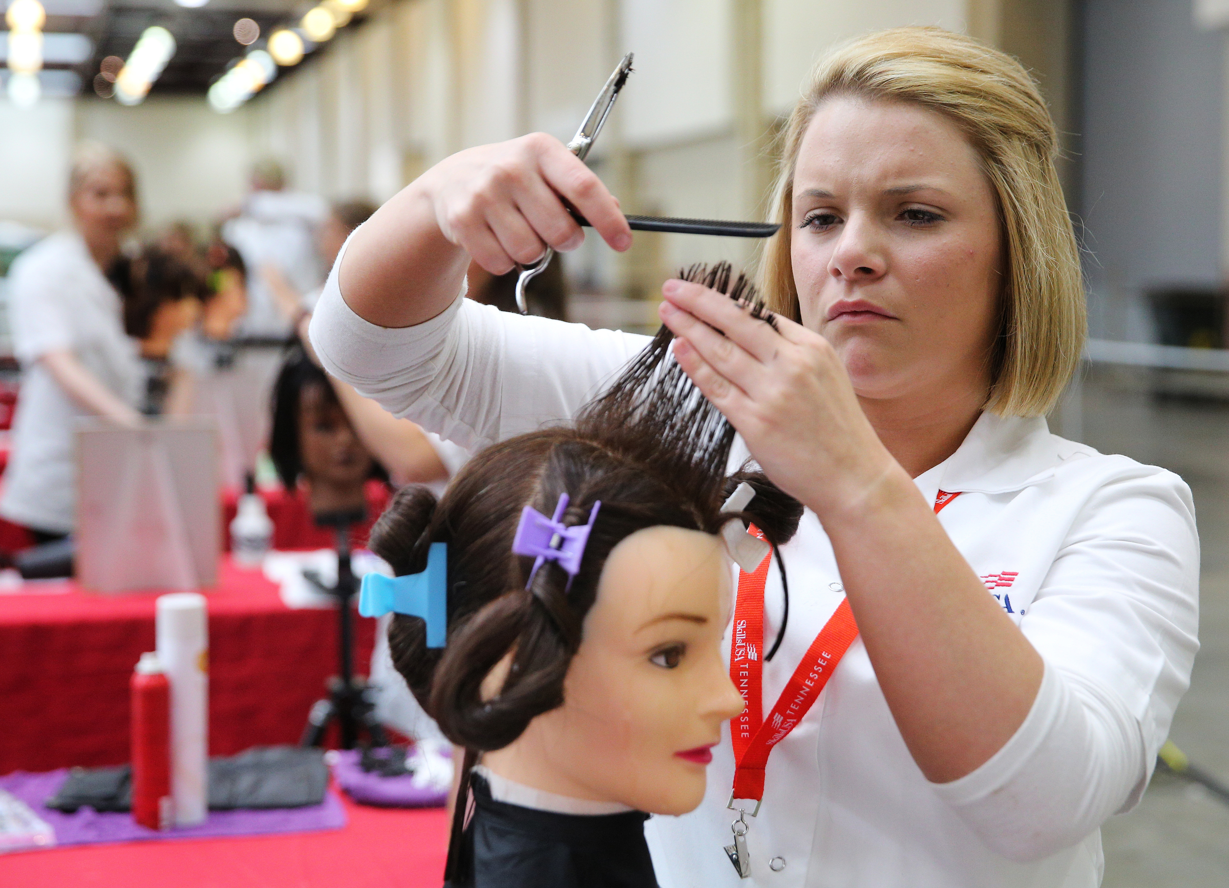 Brooklynn Smith, a Portland High School student, participates in a cosmetology competition during the Tennessee State Leadership and Skills Conference at the Chattanooga Convention Center on Tuesday, March 20, 2018 in Chattanooga, Tenn. A variety of competitions, including cosmetology, carpentry, graphic design and more, were held during the event with the winners advancing to a national competition.