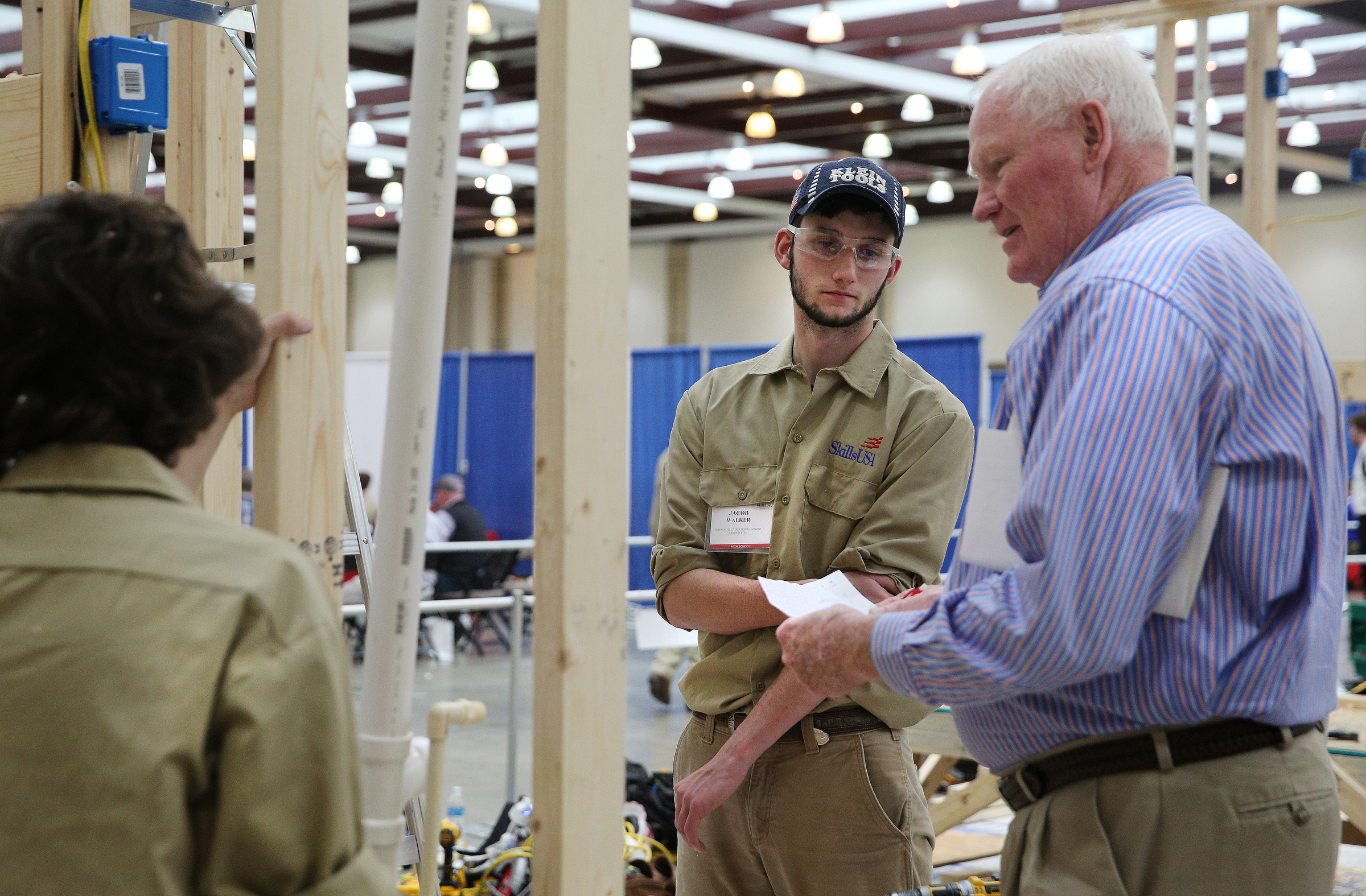 Jeffery Bunn and Jacob Walker speak with Keith Johnston, a judge, following a team construction competition during the Tennessee State Leadership and Skills Conference at the Chattanooga Convention Center on Tuesday, March 20, 2018 in Chattanooga, Tenn. Burn and Walker are students at Science Hill High School.