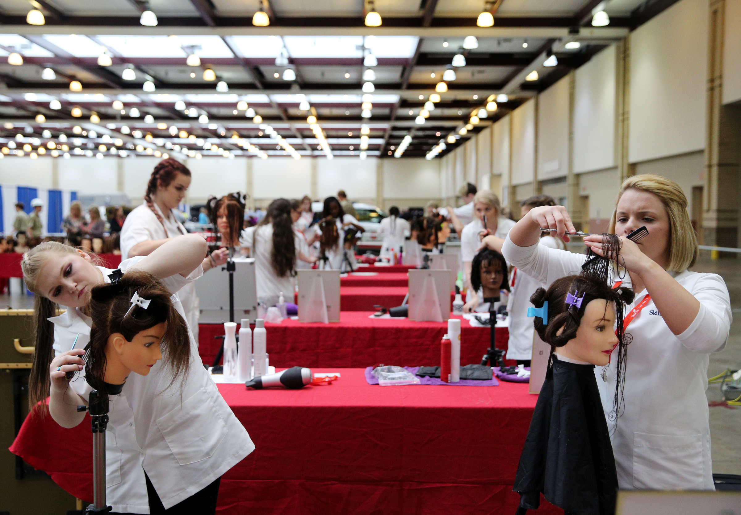 Shannah Frame, a Coffee County Central High School student, and Brooklynn Smith, a Portland High School student, participate in a cosmetology competition during the Tennessee State Leadership and Skills Conference at the Chattanooga Convention Center on Tuesday, March 20, 2018 in Chattanooga, Tenn. A variety of competitions, including cosmetology, carpentry, graphic design and more, were held during the event with the winners advancing to a national competition.