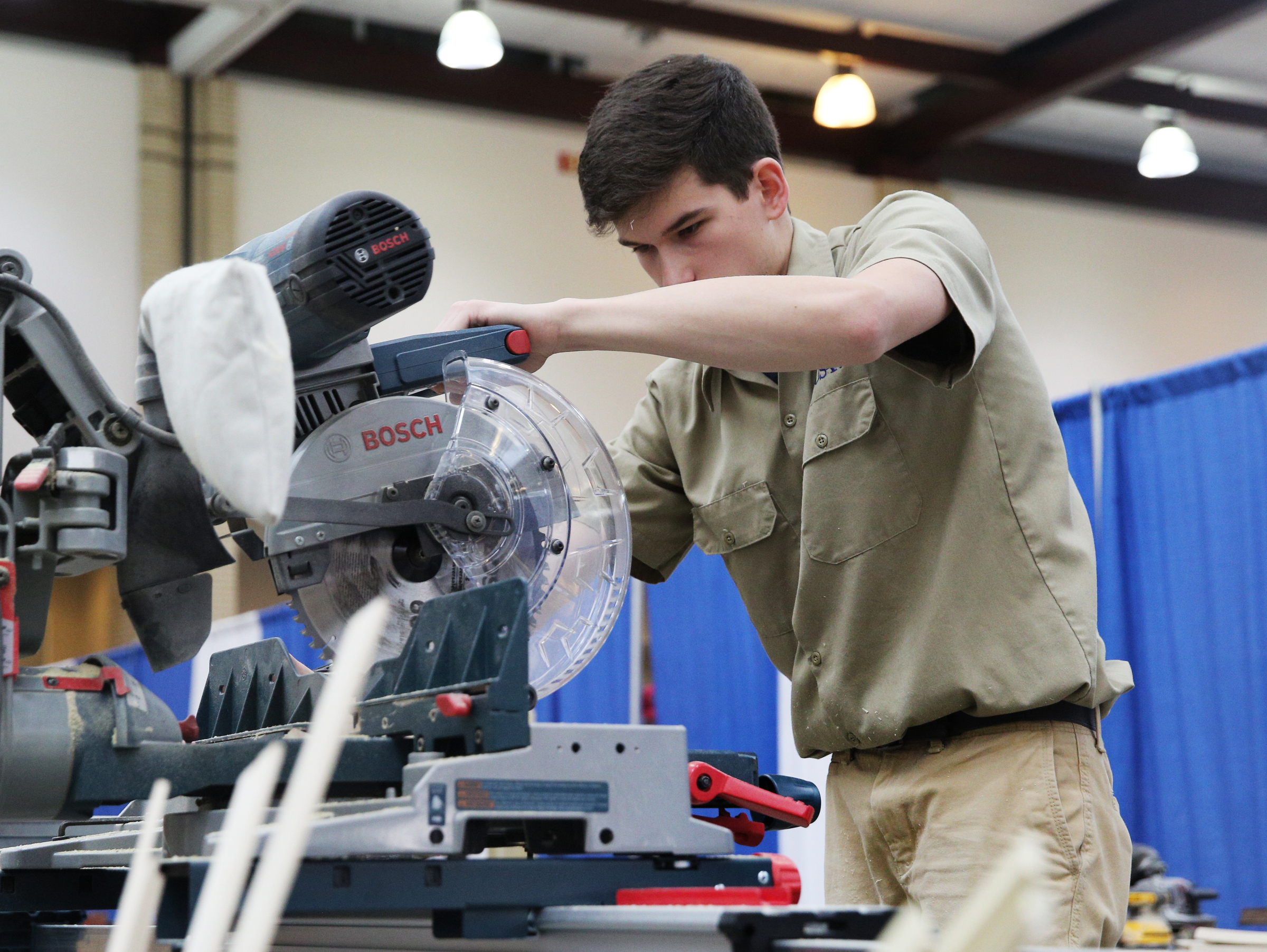 Ryder Morris, a Bradley Central High School student, uses a circular saw to cut pieces of wood during a cabinet construction competition in the Tennessee State Leadership and Skills Conference at the Chattanooga Convention Center on Tuesday, March 20, 2018 in Chattanooga, Tenn. A variety of competitions, including cosmetology, carpentry, graphic design and more, were held during the event with the winners advancing to a national competition.
