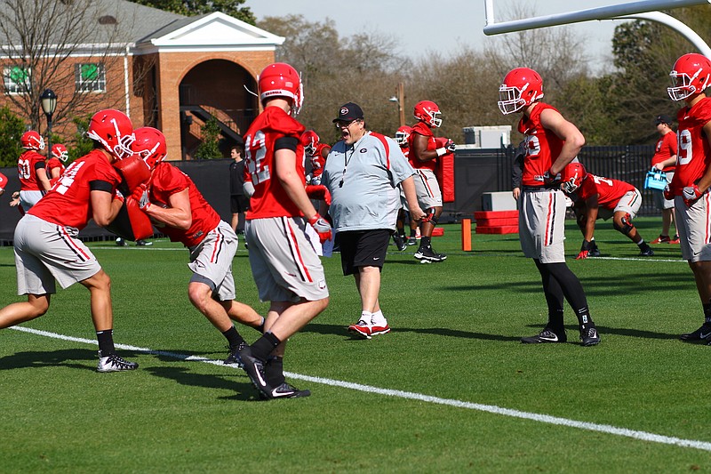 Georgia third-year offensive coordinator Jim Chaney, who will oversee tight ends this season, shouts instructions during Tuesday's inaugural spring practice
