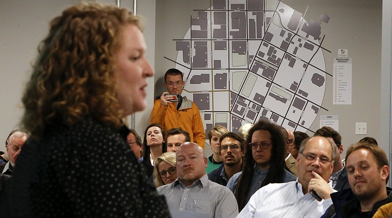 A map of the Innovation District is seen on the wall as Director of Innovation District Programs Mary Stargel speaks during a public meeting on the framework for the Innovation District on the Fifth Floor of the Edney Innovation Center on Tuesday, March 20, 2018 in Chattanooga, Tenn.