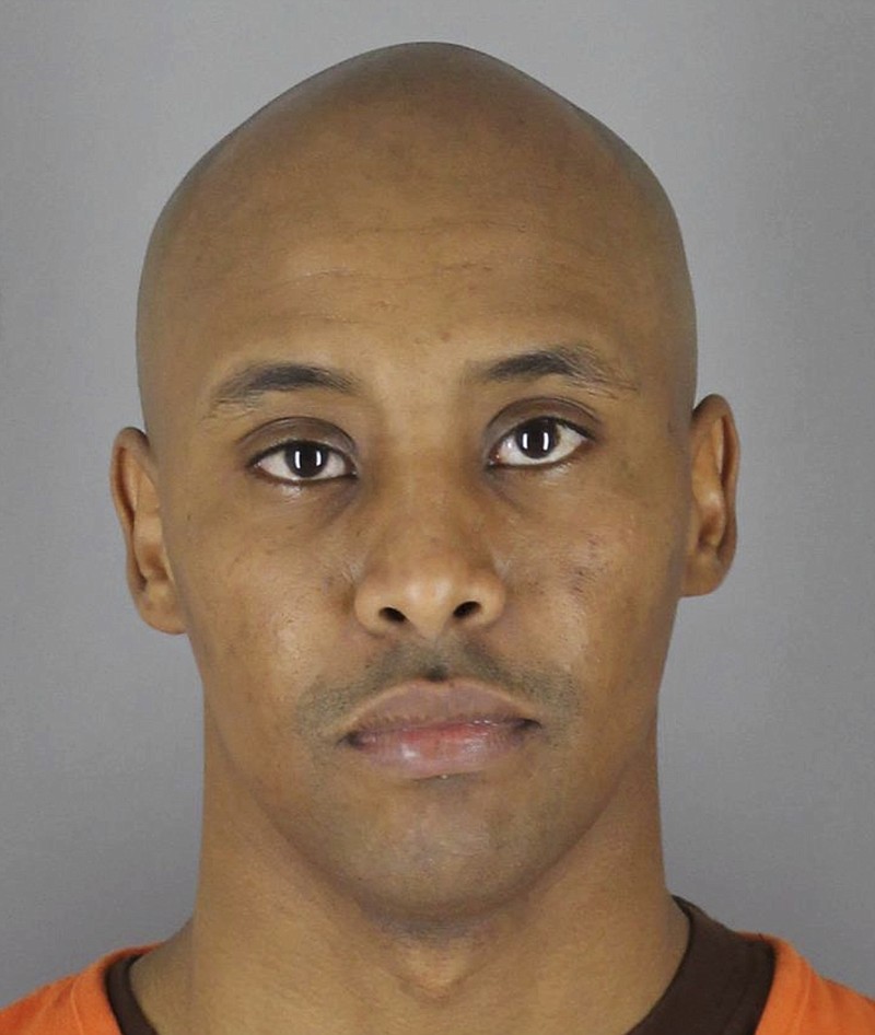 
              This March 20, 2018 photo provided by the Hennepin County Sheriff's Office in Minneapolis, Minn., shows Minneapolis Police Officer Mohamed Noor, after he turned himself in to the Hennepin County Jail. Noor was charged Tuesday with third-degree murder and second-degree manslaughter in the shooting death of an unarmed Australian woman, Justine Ruszczyk Damond, last July, minutes after she called 911 to report a possible sexual assault behind her home in Minneapolis. (Hennepin County Sheriff's Office via AP)
            