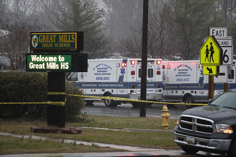 Deputies, federal agents and rescue personnel, converge on Great Mills High School, the scene of a shooting, Tuesday morning, March 20, 2018 in Great Mills, Md. (AP Photo/Alex Brandon)