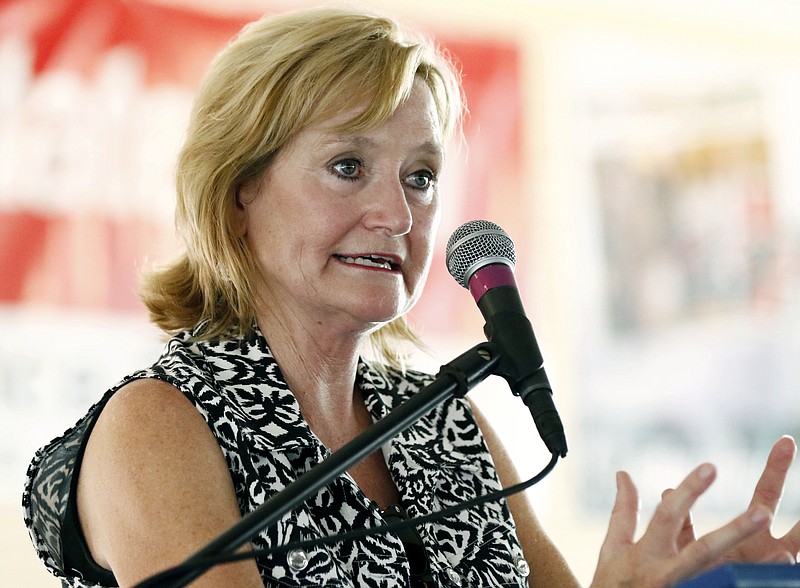 
              FILE - In this July 27, 2017, file photo Mississippi Commissioner of Agriculture and Commerce Cindy Hyde-Smith speaks at the Neshoba County Fair in Philadelphia, Miss. The state's governor will appoint Hyde-Smith as Mississippi's first female member of Congress to fill the Senate vacancy that will soon be created when Sen. Thad Cochran retires, three state Republicans told The Associated Press on Tuesday, March 20, 2018. (AP Photo/Rogelio V. Solis, File)
            