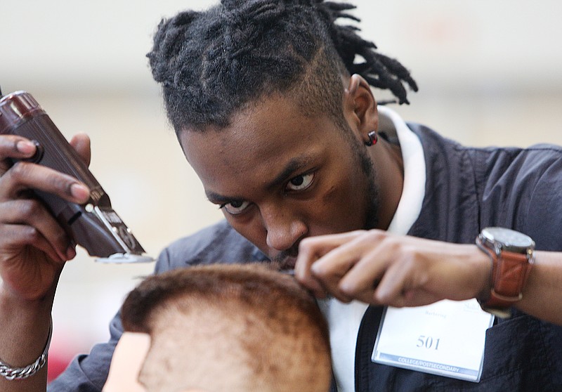 Brandon Long, a Tennessee College of Applied Technology-Paris student, participates in the barbering competition during the Tennessee State Leadership and Skills Conference at the Chattanooga Convention Center on Tuesday, March 20, 2018 in Chattanooga, Tenn. There were 110 different SkillsUSA competitions going on during the event.