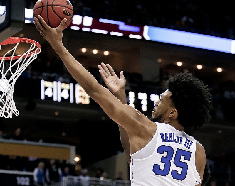 FILE - In this Saturday, March 17, 2018, file photo, Duke's Marvin Bagley III (35) shoots against Rhode Island during the first half of a second-round game in the NCAA men's college basketball tournament in Pittsburgh. Duke takes on Syracuse in a regional semifinal on Friday. (AP Photo/Keith Srakocic, File)