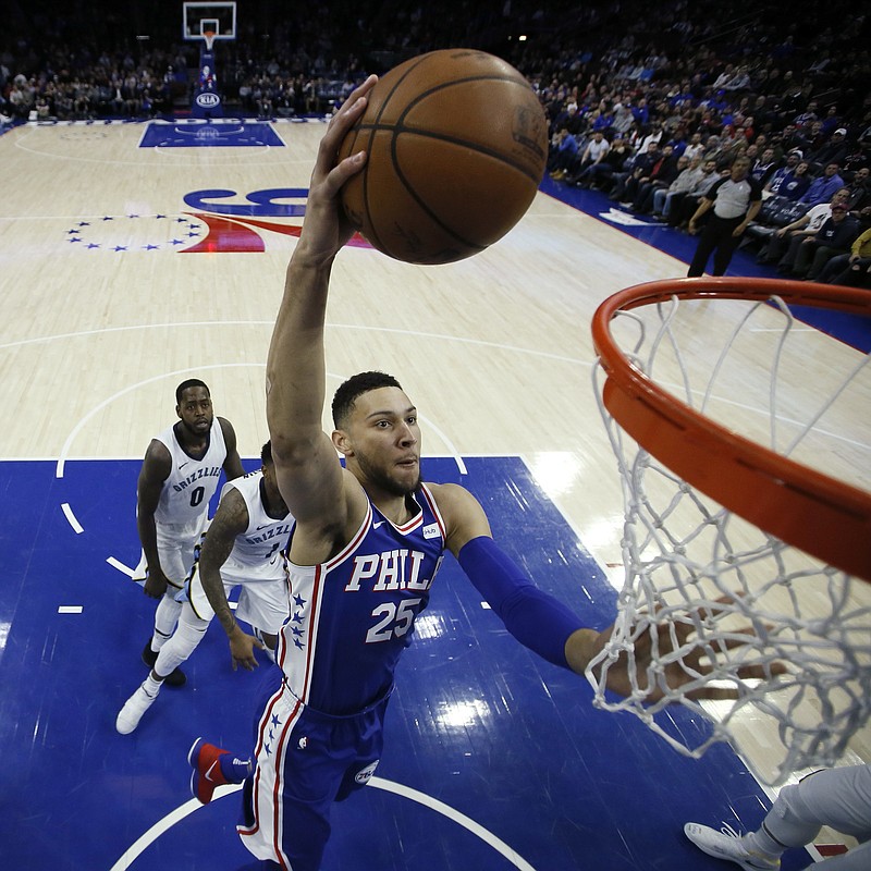 Philadelphia 76ers' Ben Simmons (25) goes up for a dunk during the first half of the team's NBA basketball game against the Memphis Grizzlies, Wednesday, March 21, 2018, in Philadelphia. (AP Photo/Matt Slocum)