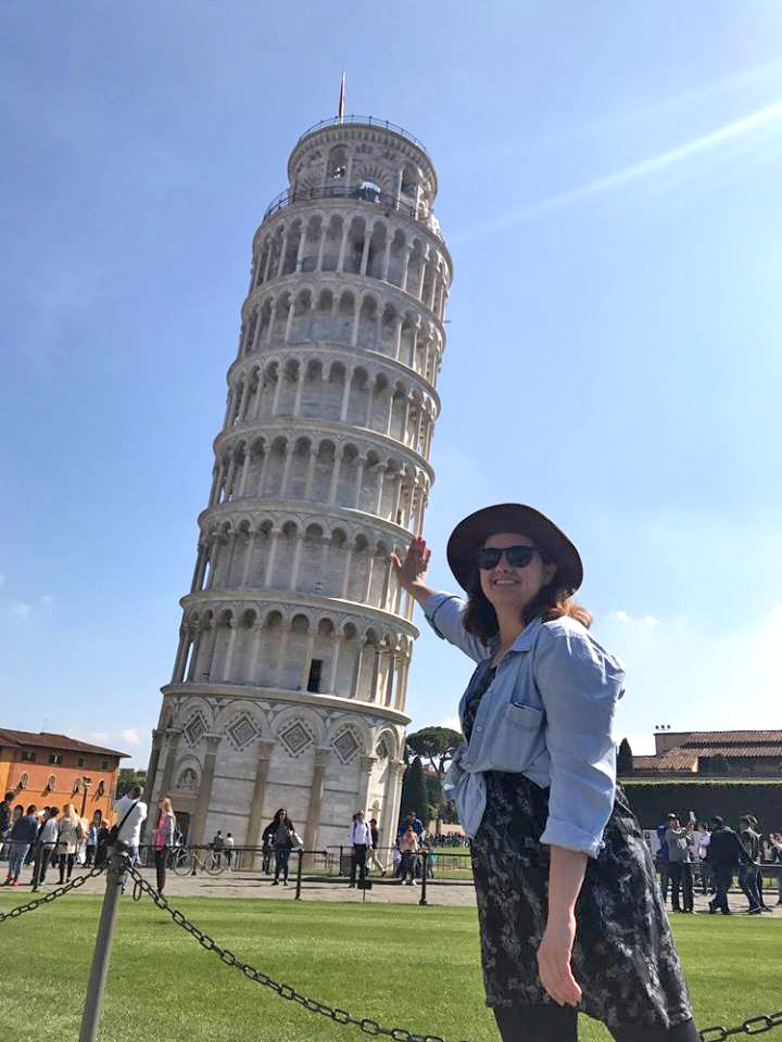 Like countless other tourists, Carson Cook pretends to keep the Tower of Pisa from falling over.