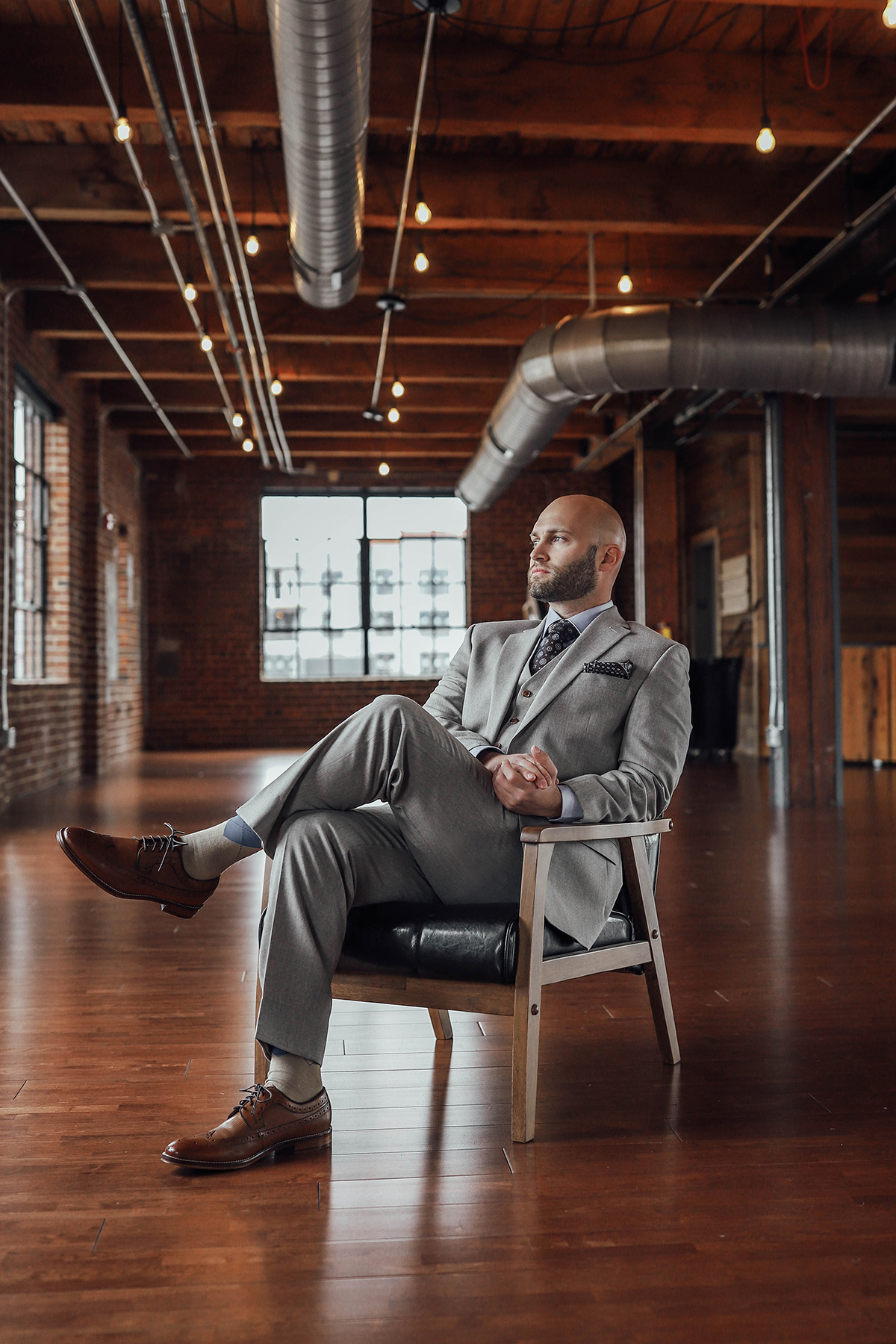 Suit: Ralph Lauren; Shirt: London Fog; Tie: Bruno Piatelli; Shoes: Johnston & Murphy; Silk Handkerchief: Sterling Sewn. All available at Giorgio Men's Warehouse