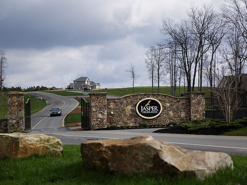 The stone gate to the Jasper Highlands community. (Staff photo by Doug Strickland)