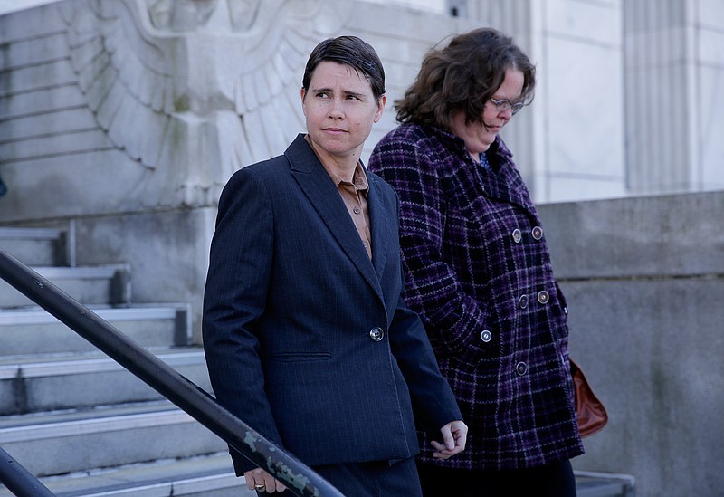 Former Juvenile Court magistrate Elizabeth Gentzler, left, leaves the Joel W. Solomon Federal Courthouse with her wife Jennifer during a trial recess on Thursday, March 22, 2018, in Chattanooga, Tenn. Testimony continued Thursday in Gentzler's federal lawsuit against Hamilton County, Juvenile Court Judge Rob Philyaw and administrator Sam Mairs which claims Gentzler was discriminated against and fired in 2014 for being gay.