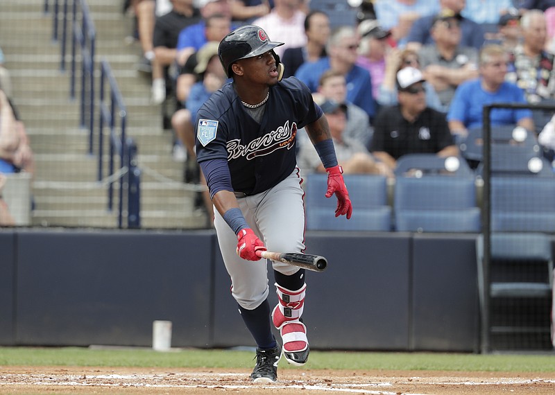 FILE - In this March 2, 2018, file photo, Atlanta Braves' Ronald Acuna watches after hitting a two run home run during the first inning of a baseball spring exhibition game against the New York Yankees in Tampa, Fla. The Braves need Acuna's power and speed in their lineup if they hope to move closer to .500 following their 72 wins in 2017. (AP Photo/Lynne Sladky, File)

