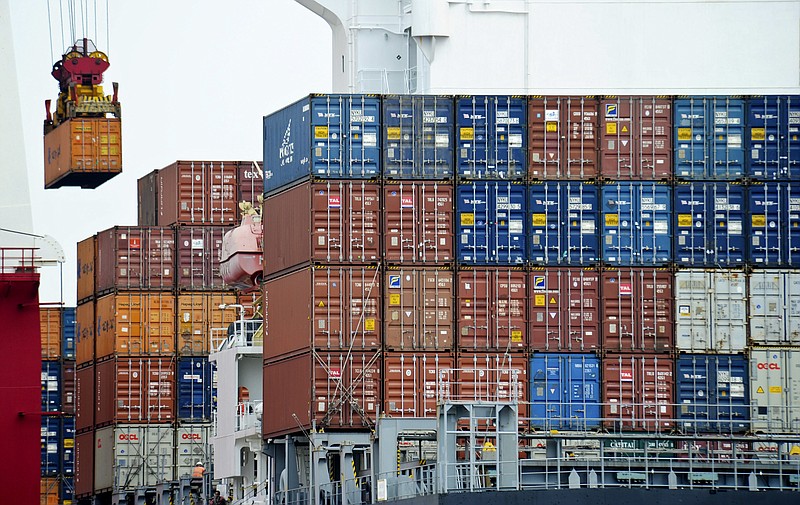 In this Aug. 5, 2010, file photo, a container is loaded onto a cargo ship at the Tianjin port in China. Farmers, electronics retailers and other U.S. businesses are bracing for a backlash as President Donald Trump prepares to target China for stealing American technology or pressuring U.S. companies to give it away. (AP Photo/Andy Wong, File)