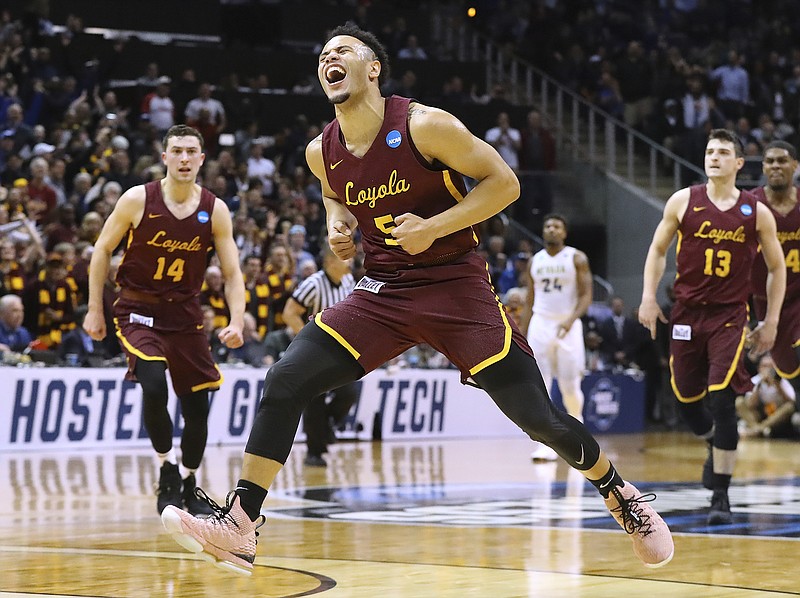 Loyola-Chicago guard Marques Townes reacts to hitting a 3-pointer in the final minute of the team's 69-68 victory over Nevada during an NCAA men's college basketball tournament regional semifinal Thursday, March 22, 2018, in Atlanta. (Curtis Compton/Atlanta Journal-Constitution via AP)