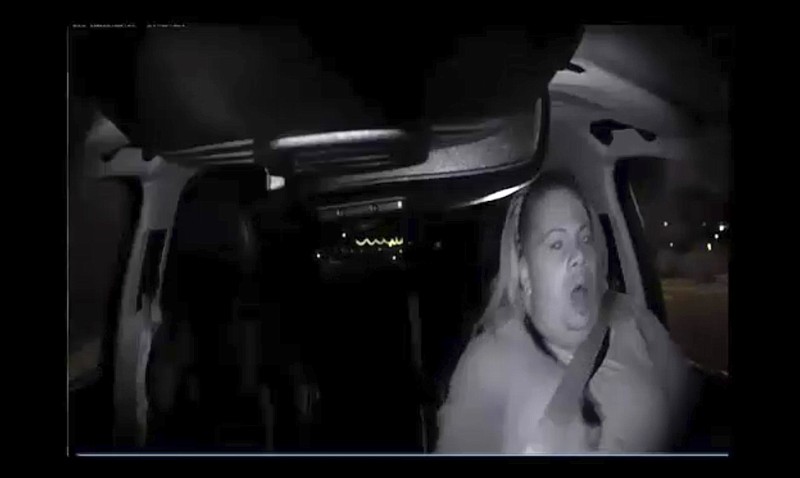 
              This image made from video Sunday, March 18, 2018, of a mounted camera provided by the Tempe Police Department shows an interior view moments before an Uber SUV hit a woman in Tempe, Ariz. The video shows a human backup driver in the SUV looking down until seconds before the crash. The driver looked up and appeared startled during the last moment of the clip. (Tempe Police Department via AP)
            