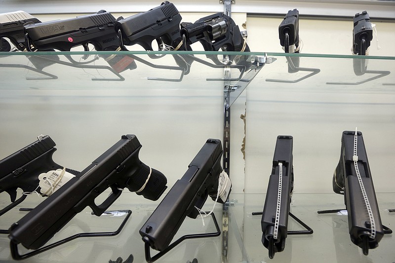 
              FILE - This June 29, 2016, file photo shows guns on display at a gun store in Miami. Support for tougher gun control laws is soaring in the United States, according to a new poll that found a majority of gun owners and half of Republicans favor new laws to address gun violence in the weeks after a Florida school shooting left 17 dead and sparked nationwide protests. (AP Photo/Alan Diaz, File)
            