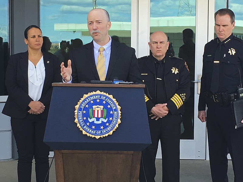 
              Sean Ragan, FBI special agent in charge, briefs reporters about a crash at the main gate of Travis Air Force Base, Calif., Friday, March 23, 2018. A 51-year-old man drove a flaming minivan loaded with propane tanks and gasoline cans through the main gate of the major Northern California Air Force base, authorities said, but added the driver had no known links to terrorism. (AP Photo/Jonathan J. Cooper)
            