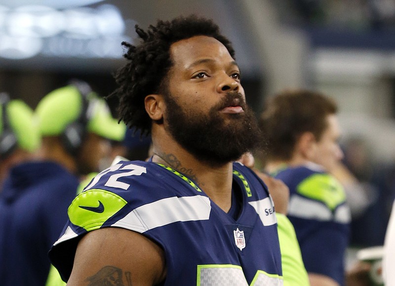 FILE - In this Dec. 24, 2017, file photo, Seattle Seahawks defensive end Michael Bennett (72) watches his team play the Dallas Cowboys during an NFL football game in Arlington, Texas. A Harris County, Texas, grand jury on Friday, March 23, 20187, indicted Philadelphia Eagles defensive end Michael Bennett on a felony count of injury to the elderly for injuring a 66-year-old paraplegic who was working at NRG Stadium in Houston to control access to the field at Super Bowl 51, prosecutors said. The Eagles earlier this month acquired Bennett from the Seahawks. (AP Photo/Michael Ainsworth, File)

