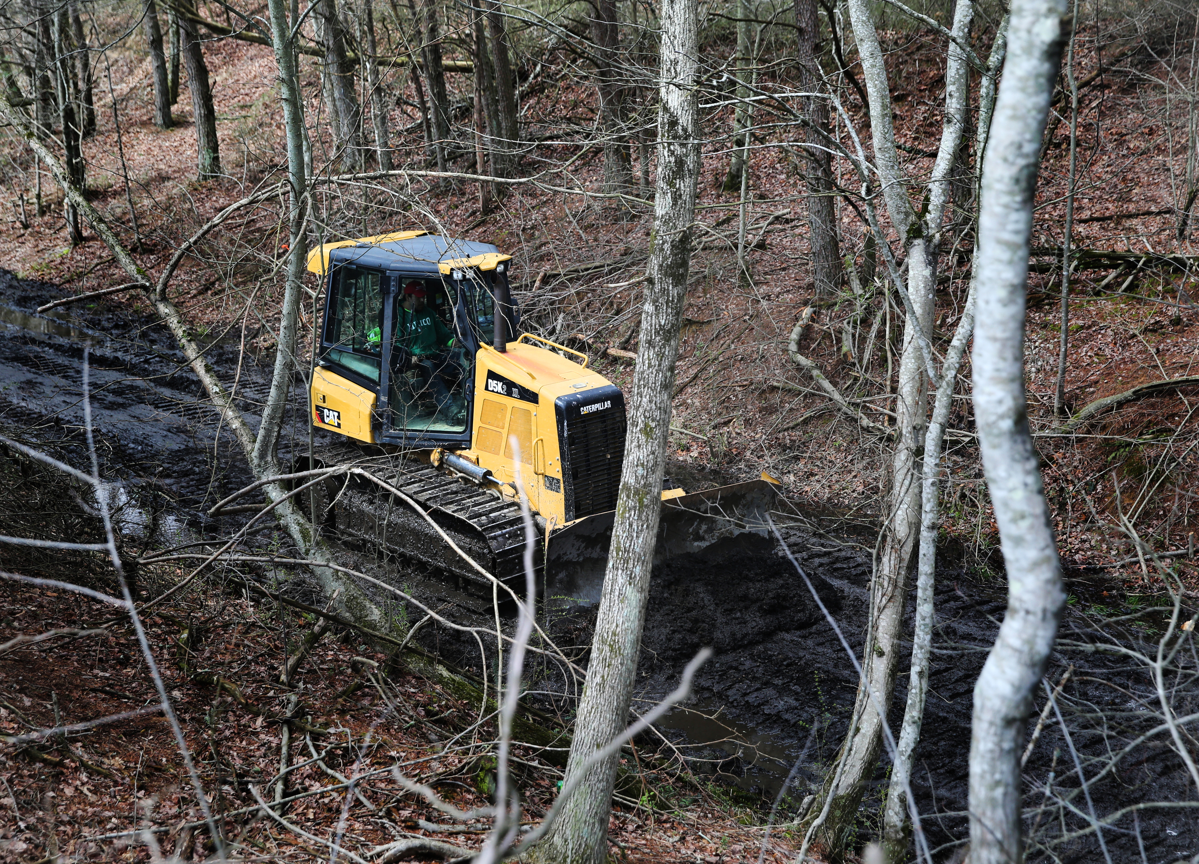 TREED and Associates workers bulldoze areas of along what will be a part of the Mountain Goat Trail Wednesday, March 21, 2018 in Tracy City, Tenn. The multi-use walking and cycling trail will eventually link seven towns in Grundy and Franklin counties.