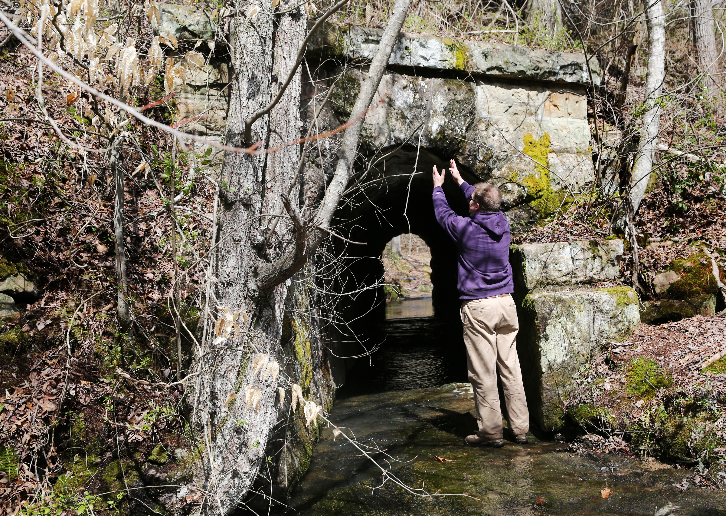 Lawson Bordley of Robert G. Campbell engineering firm points out the elaborate construction of a culvert that is under a portion of the Mountain Goat Trail Wednesday, March 21, 2018 in Tracy City, Tenn. A multi-use walking and cycling trail connecting the communities along the path of the historic Mountain Goat Railroad has two ongoing construction projects as the area continues to develop the trail system.