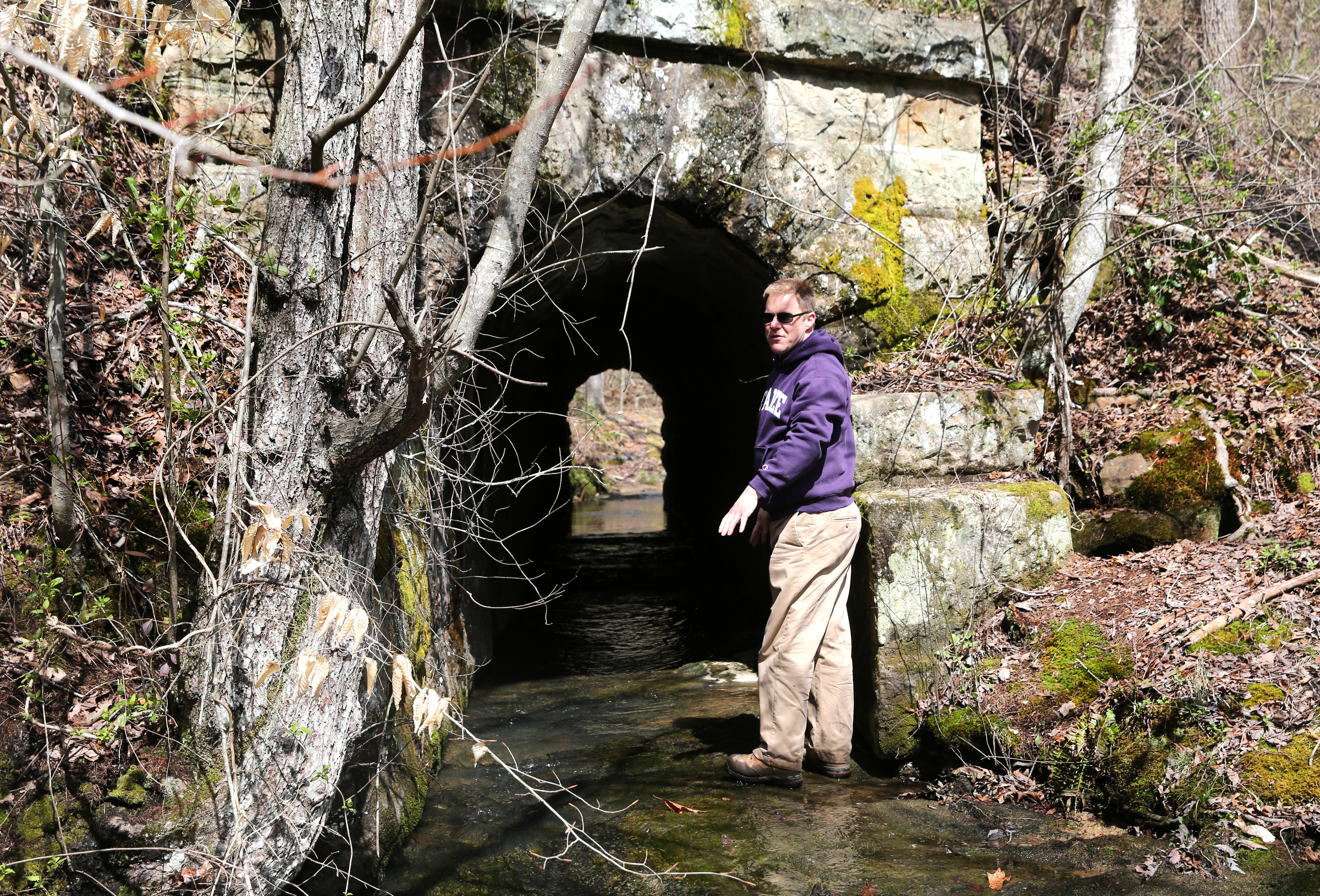 Lawson Bordley of Robert G. Campbell engineering firm points out the elaborate construction of a culvert that is under a portion of the Mountain Goat Trail Wednesday, March 21, 2018 in Tracy City, Tenn. A multi-use walking and cycling trail connecting the communities along the path of the historic Mountain Goat Railroad has two ongoing construction projects as the area continues to develop the trail system.