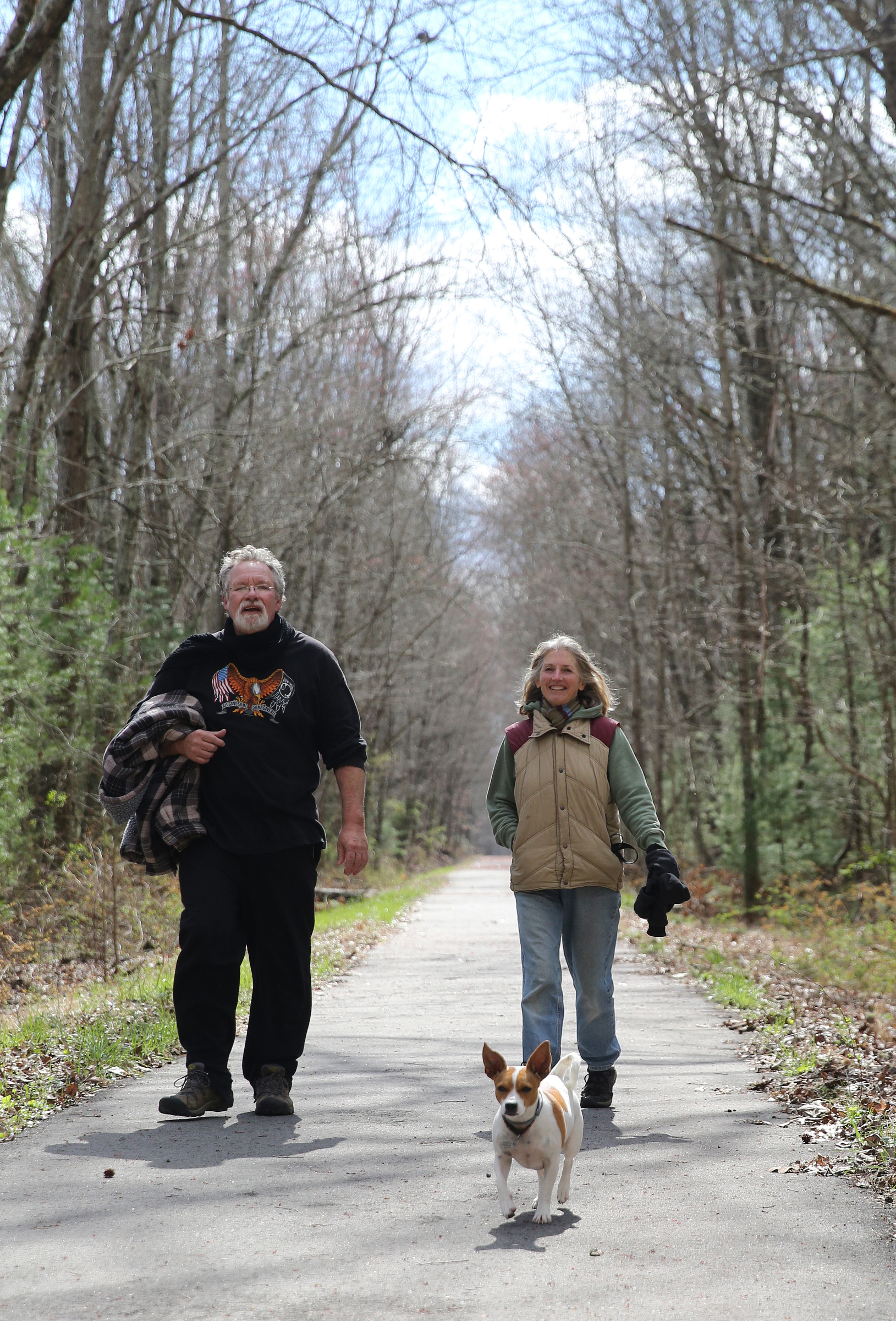 Regina and Keith Childress walk with their dog Gipsy along a finished portion of the Mountain Goat Trail Wednesday, March 21, 2018 in Tracy City, Tenn. The multi-use walking and cycling trail will eventually link seven towns in Grundy and Franklin counties.