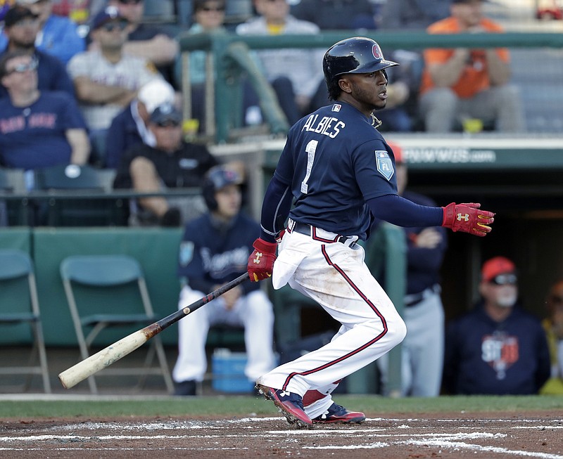 Atlanta Braves' Ozzie Albies hits a single in the first inning of a spring baseball exhibition game against the Detroit Tigers, Wednesday, March 21, 2018, in Kissimmee, Fla. (AP Photo/John Raoux)
