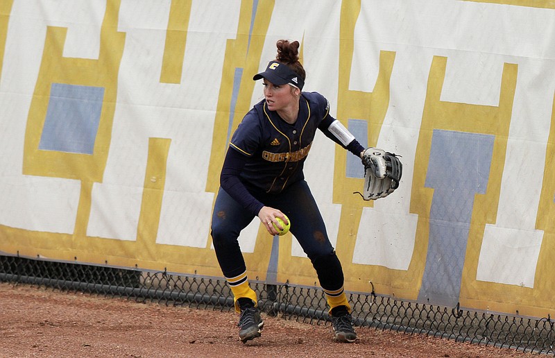 UTC center fielder Alyssa Coppinger prepares to throw to the infield after missing a catch during the Mocs' 11-0 five-inning loss to Mercer on Sunday at Frost Stadium. The Mocs were swept in the three-game series to open SoCon play. A story is on C4.